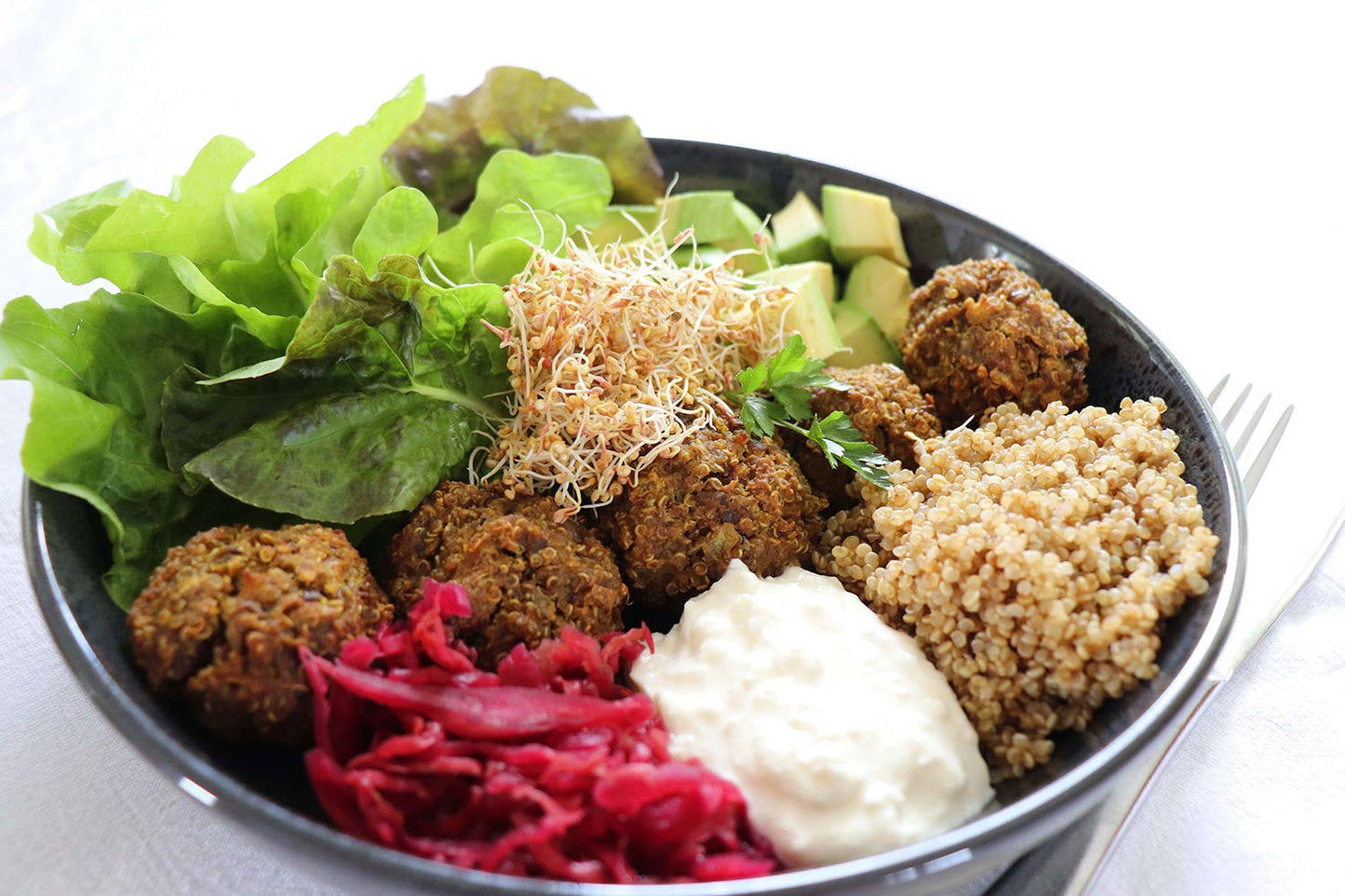 Quinoa and Lentil Balls Served with Lemon Feta Smash